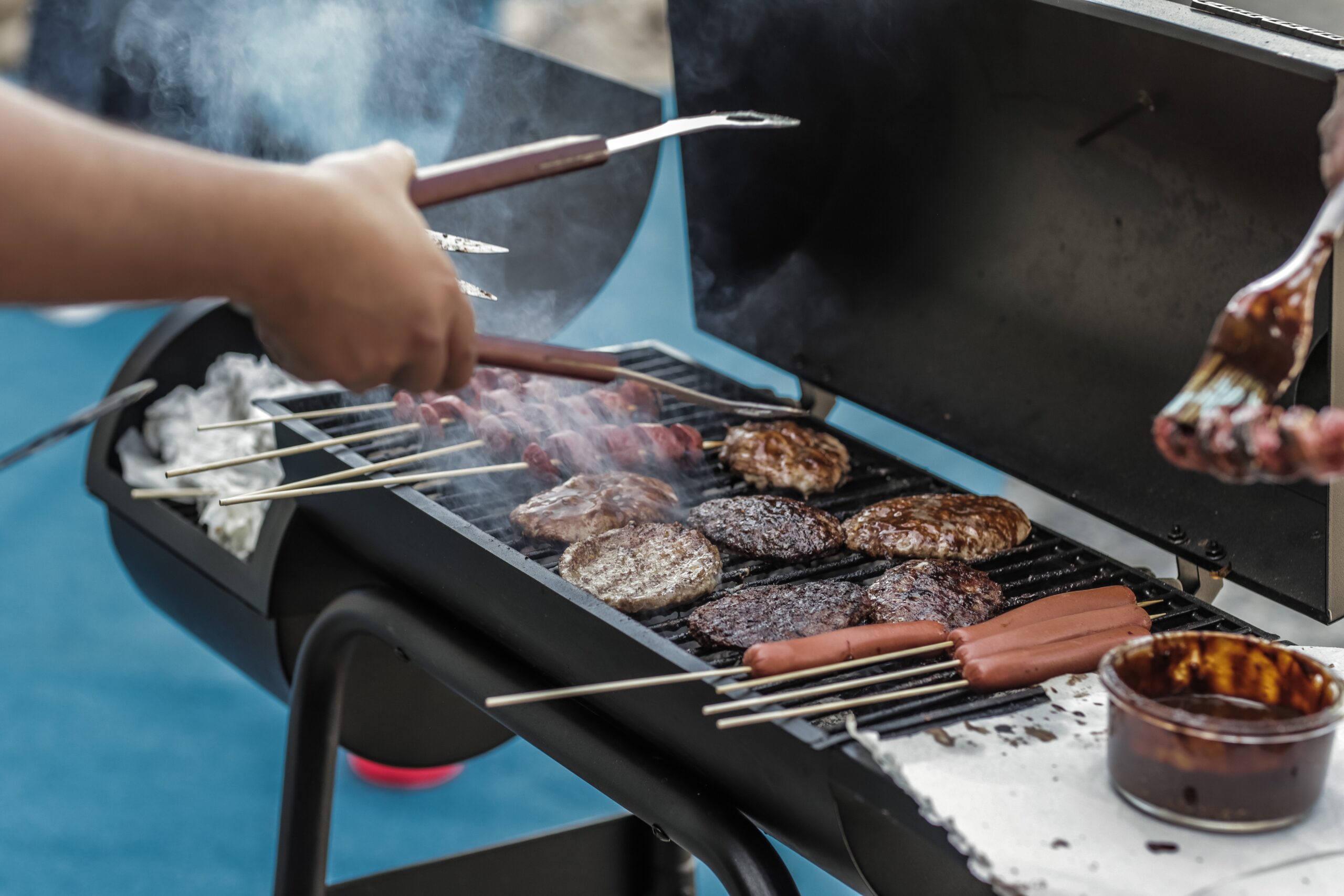 grilling hotdogs on a bbq